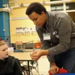 MIT student Joshua Verdejo teaching and creating electric circuits with Bagnall sixth grade student Ian Anderson. (Courtesy Photo Bagnall Elementary School)