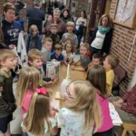 Students gather around Kindergartener Issac Jones while he presents his Passion Project (Courtesy Photo Bagnall Elementary School)