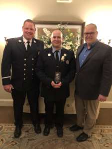 (Left-to-right: Groveland Fire Lieutenant Daniel Briscoe, Firefighter Brian Belfiore, and Interim Fire Chief Kurt Ruchala, at the Steward Health Care "EMS Stewards of the Community" awards night in Quincy on Tuesday, March 22. (Groveland Fire Department/Courtesy Photo)